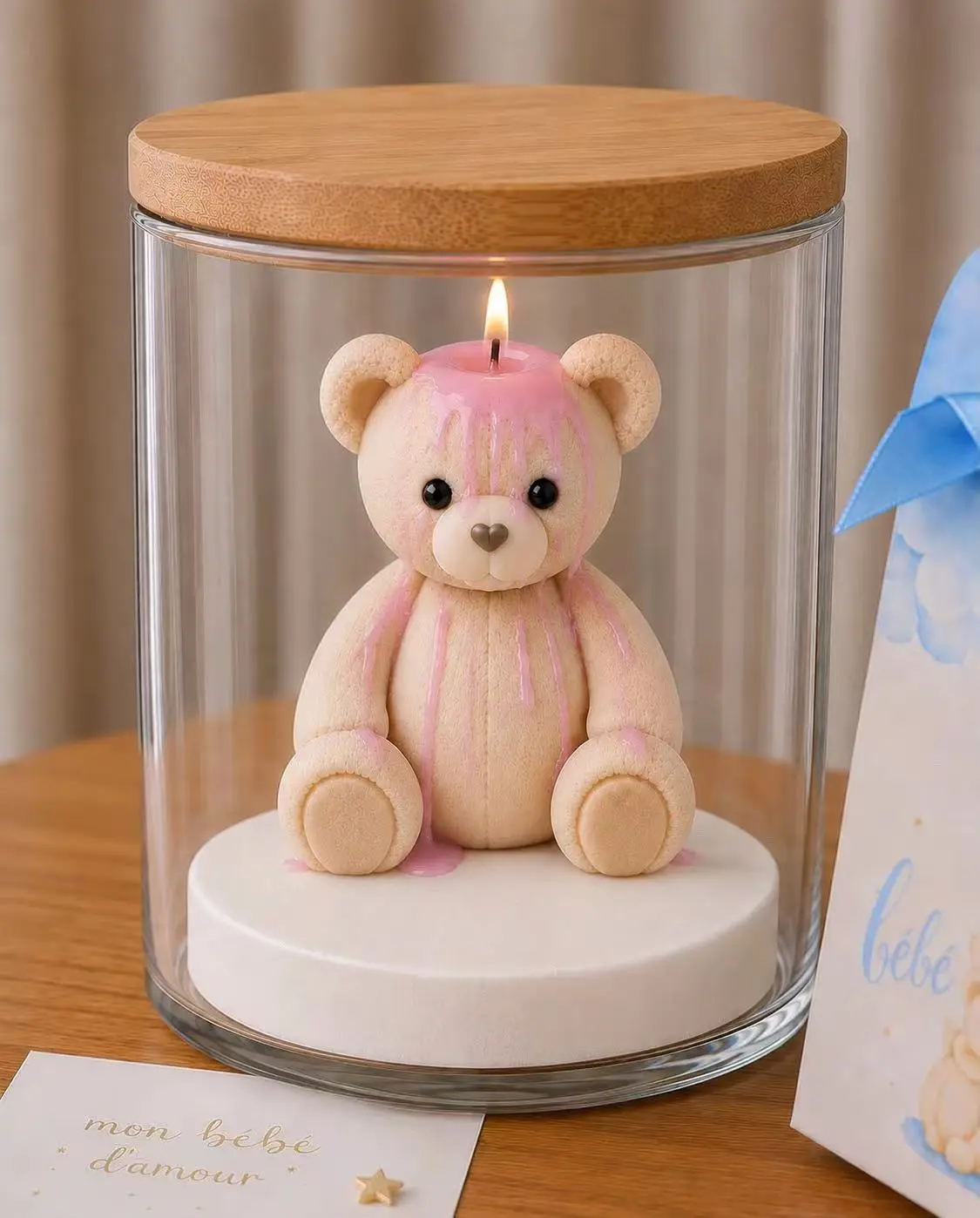 Custom pink-finished teddy bear candle in a clear glass display jar with a natural wood lid