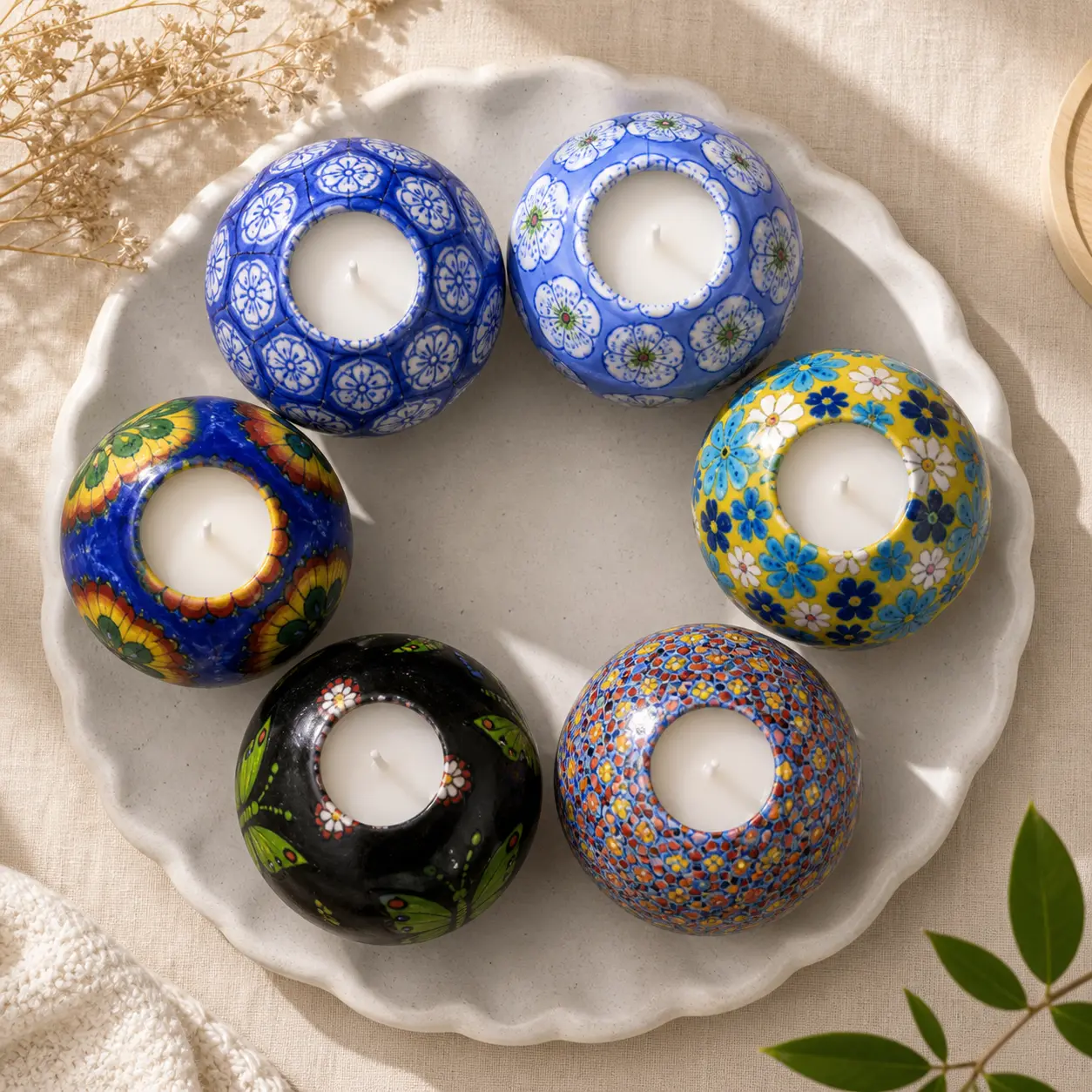 Top view of six patterned spherical craft candles